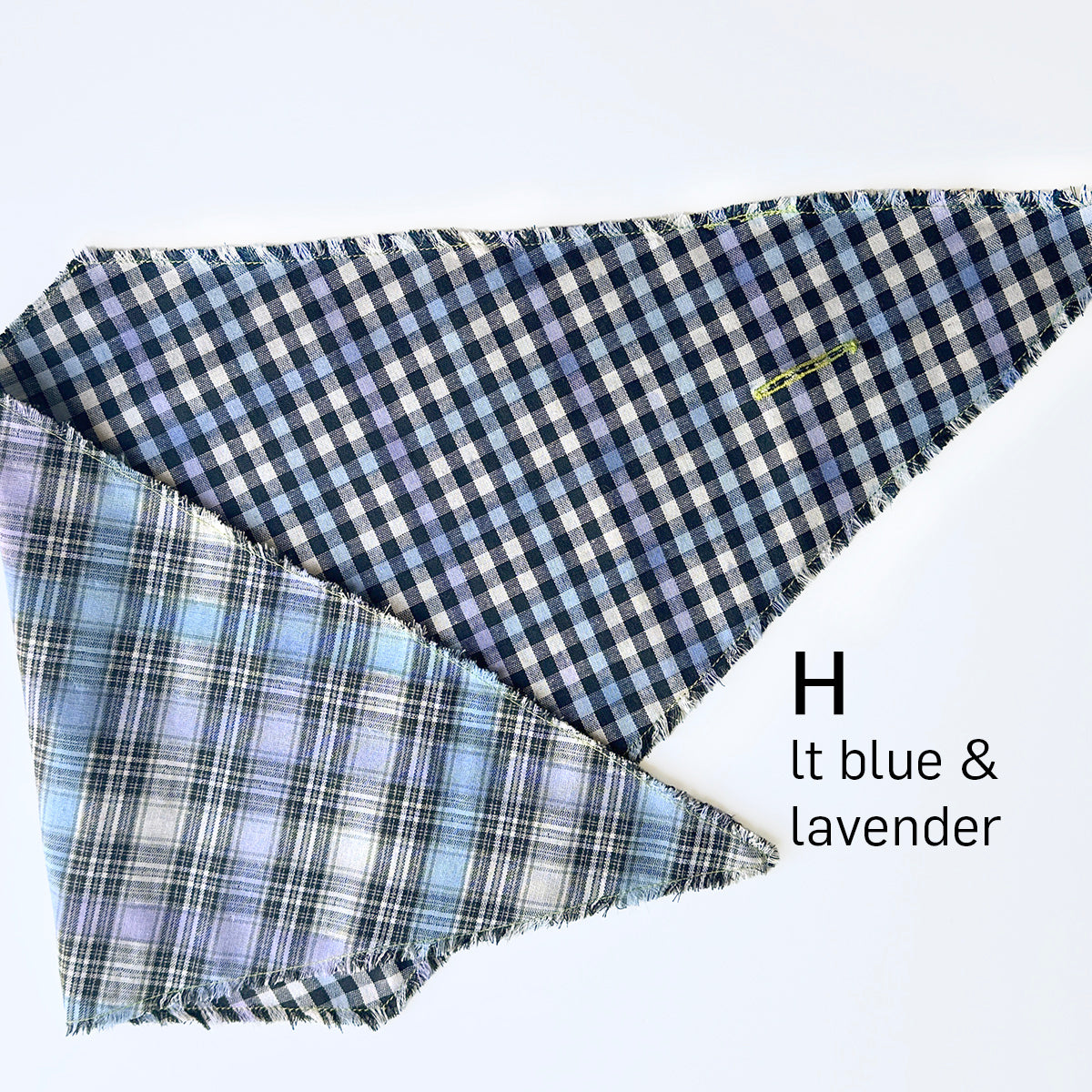 Folded plaid diamond scarf on a white background, labeled 'H lt blue & lavender'. The top fabric is a dark navy and white gingham, and the bottom-left fabric is a light blue and lavender plaid.