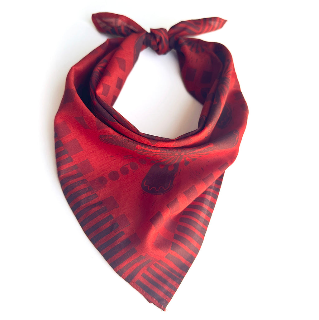 hand printed Red patterned scarf on a white background